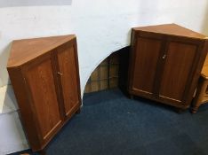 Two small teak corner cabinets and a pair of stick back chairs