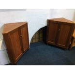 Two small teak corner cabinets and a pair of stick back chairs