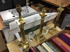 Three brass lamps