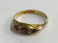 A 9ct pearl and garnet ring