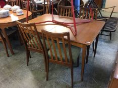 A teak table and four teak G Plan chairs