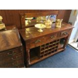 A three drawer side table with over mirror