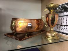 A copper planter, lamp and tray