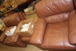 Pair of leather armchairs and a foot stool