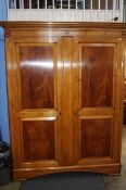 A large Charles Barr double door wardrobe. 157 cm wide (not including cornice), 214 cm high