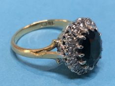 An 18ct diamond and sapphire ring, size 'L', 5 grams