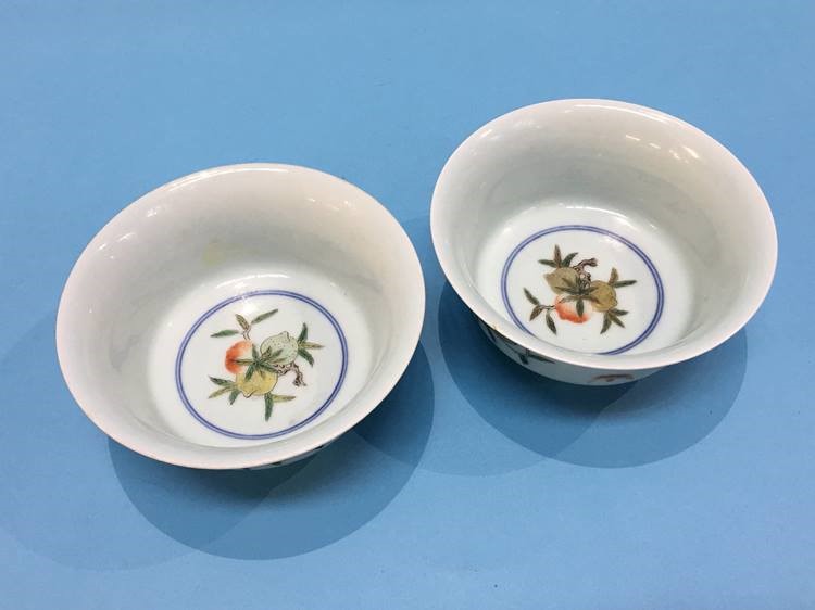 A pair of Chinese shallow circular bowls. 14cm diameter