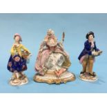 A pair of Continental porcelain figures of a gallant and lady and a Capo di Monte figure of a seated