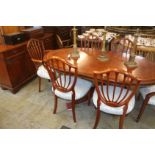 A reproduction mahogany dining room suite