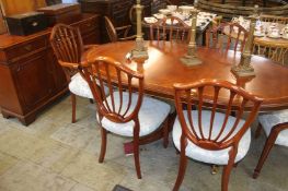 A reproduction mahogany dining room suite