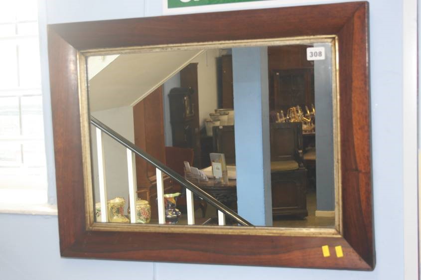 A rosewood framed mirror