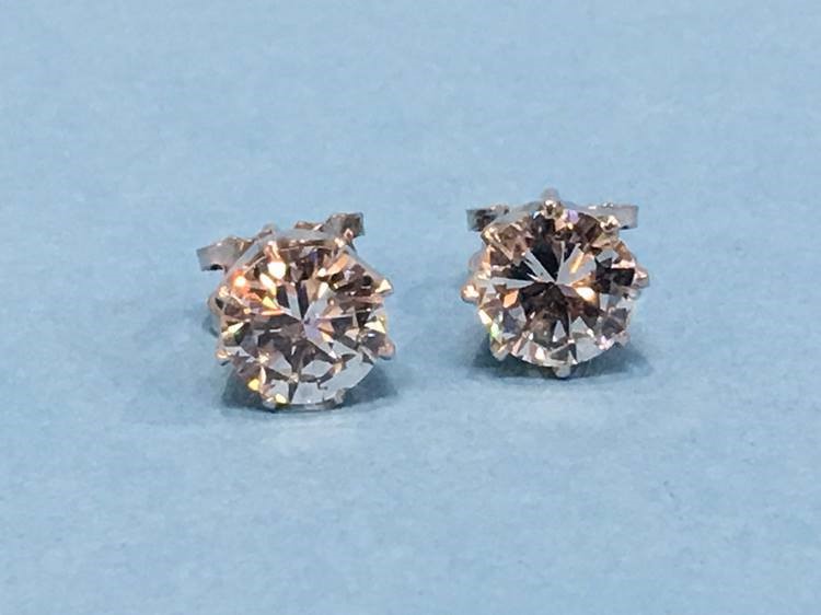 A pair of diamond earrings, each diamond approximately 1 carat - Image 10 of 17