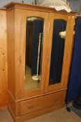 An Edwardian two door mirrored wardrobe