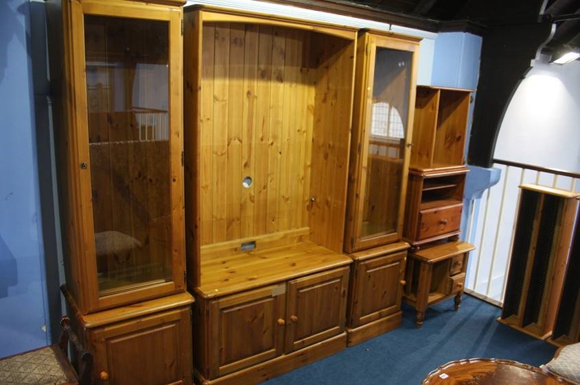 Three pine display units, modern chest of drawers, two CD stands etc.