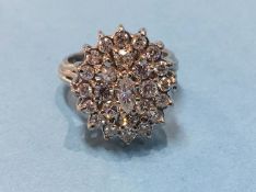 An 18ct white gold and diamond cluster ring, size 'L', 9 grams
