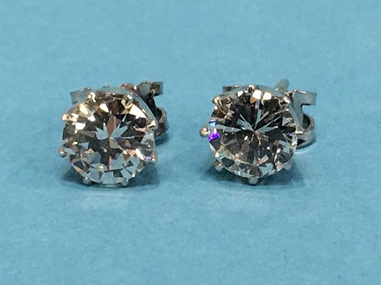 A pair of diamond earrings, each diamond approximately 1 carat - Image 6 of 17