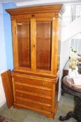 A Charles Barr bookcase, the top with glazed doors below four long drawers. 94 cm wide