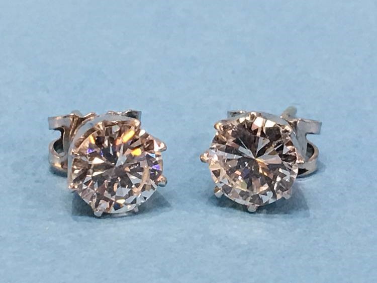 A pair of diamond earrings, each diamond approximately 1 carat - Image 2 of 17