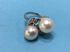 A white metal diamond and pearl ring, size 'G', 6.3 grams