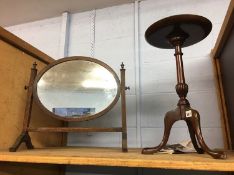 A tripod table and a mirror