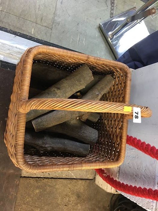 A wicker basket of logs