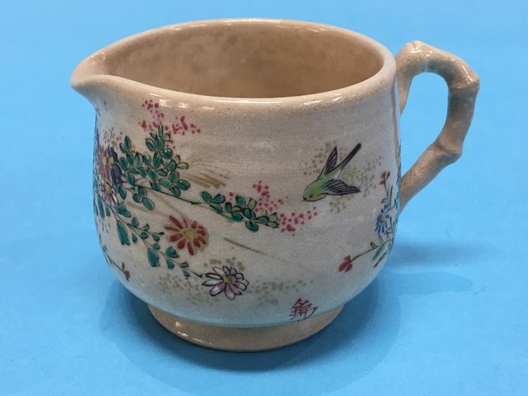 A small Satsuma ware cream jug