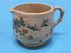 A small Satsuma ware cream jug