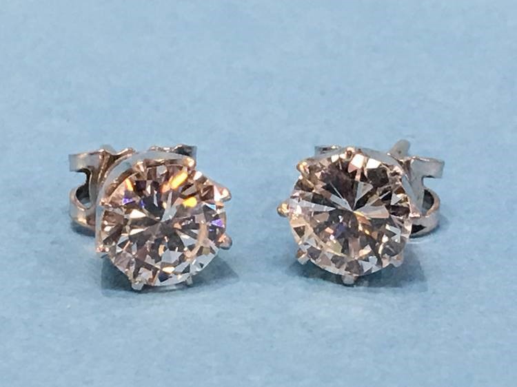 A pair of diamond earrings, each diamond approximately 1 carat - Image 3 of 17