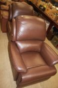 Pair of brown leather reclining chairs