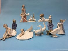 Twelve Lladro and Nao figures, various