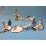 Twelve Lladro and Nao figures, various