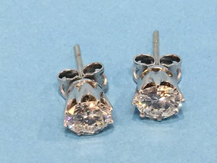 A pair of diamond earrings, each diamond approximately 1 carat - Image 9 of 17