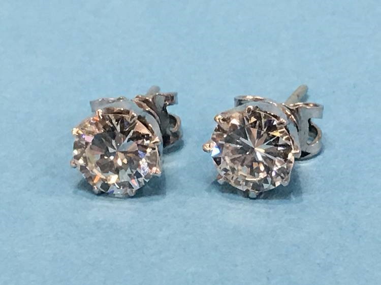 A pair of diamond earrings, each diamond approximately 1 carat - Image 7 of 17