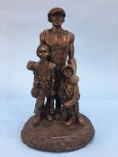 A Robert (Bob) Olley bronze coloured sculptured mining figure group.