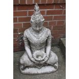 A garden statue of Buddha