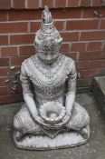 A garden statue of Buddha
