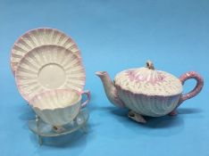 A Belleek 'Shell' design trio and a matching 'Shell' teapot, black printed mark