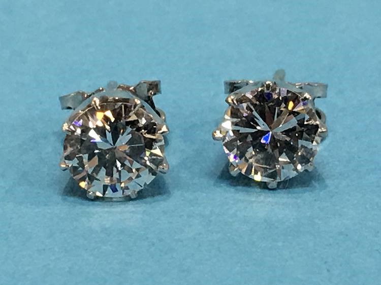 A pair of diamond earrings, each diamond approximately 1 carat - Image 4 of 17