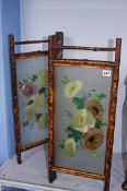 A small bamboo and three glass folding screen