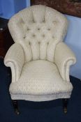 A Victorian style button back cream chair