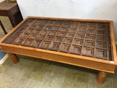 A large temple door converted to a coffee table