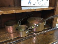 Set of six graduated copper pans