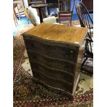 Walnut serpentine chest of drawers