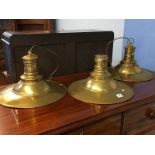 Three brass light shades