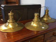 Three brass light shades