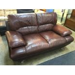 Brown leather two seater with chrome legs