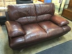 Brown leather two seater with chrome legs