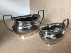 A silver cream jug and sugar bowl, various dates and makers, 462g