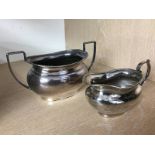 A silver cream jug and sugar bowl, various dates and makers, 462g