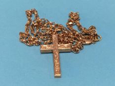 A 9ct gold crucifix together with a chain stamped 9kt, Italy, weight 18.2g